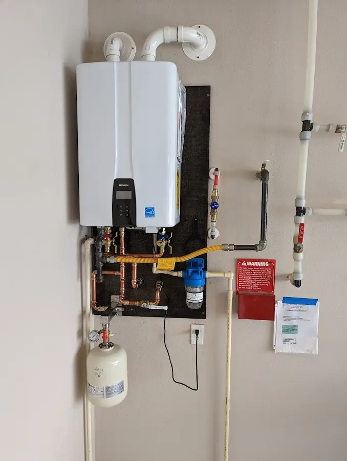 Professional plumber installing copper piping in a East Basin home